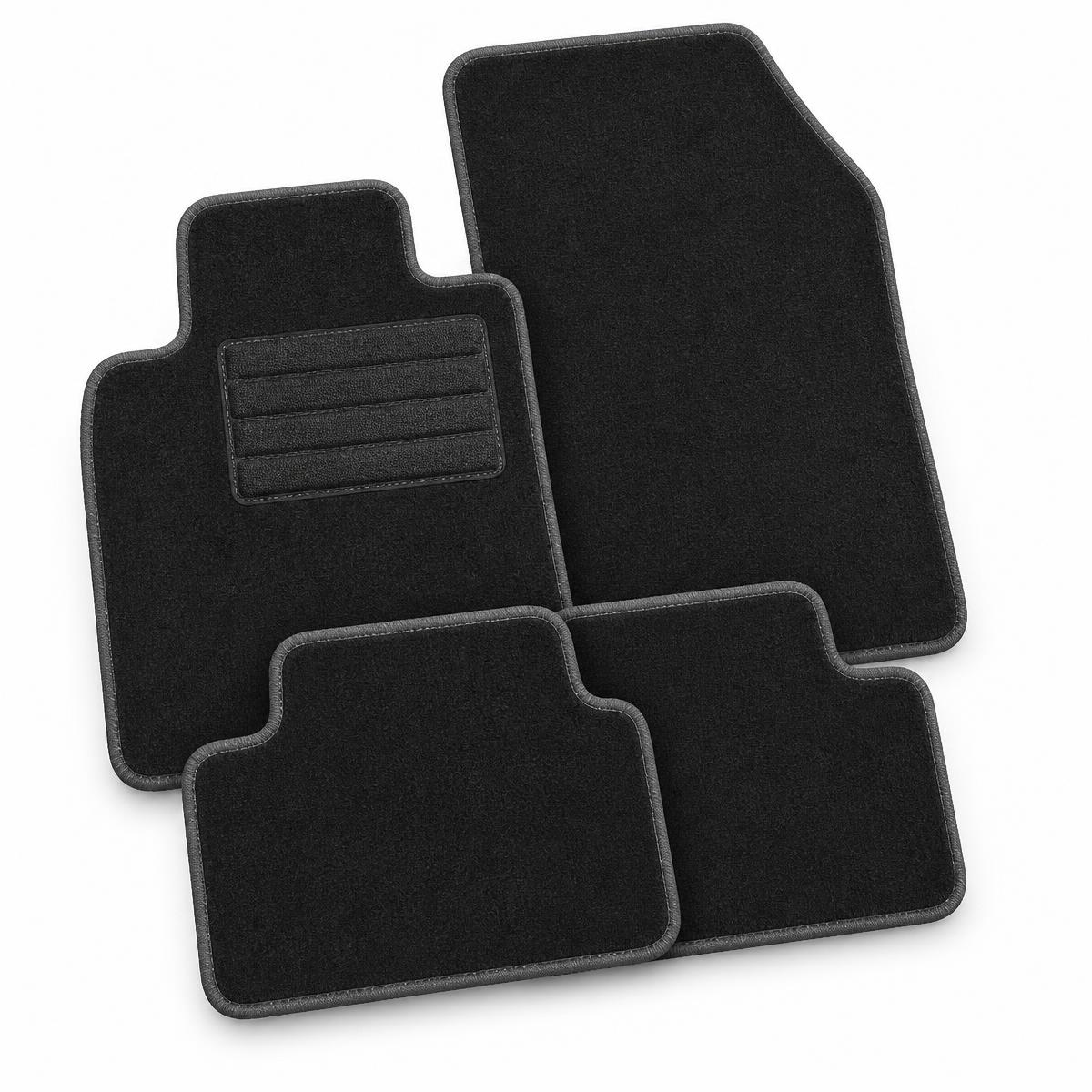 Set of four tailored black car floor mats with stitched trim on a white background